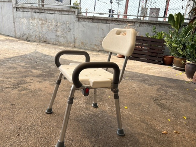 Shower chair front view showing backrest and adjustable legs