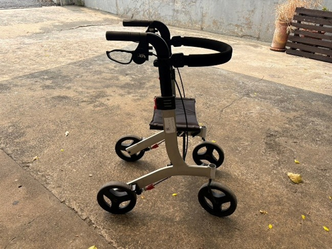 Walker rollator folded, side view showing compact size