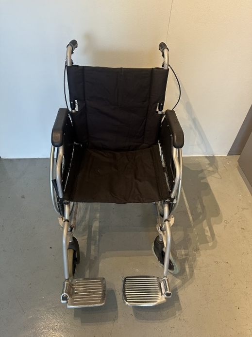 Wheelchair rear view showing push handles