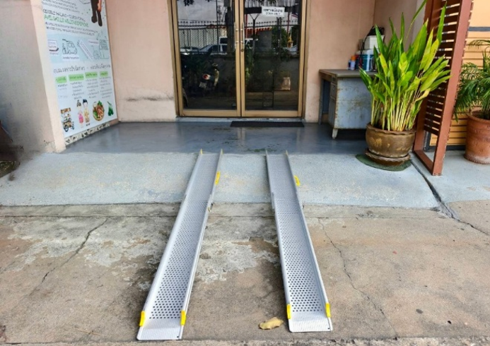 Wheelchair ramp folded flat on floor