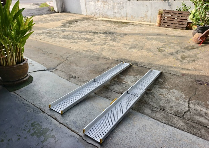 Wheelchair ramp deployed at building entrance steps